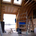 View of the sheltered communal space with its 'cathedral ceiling and views out over the water.
